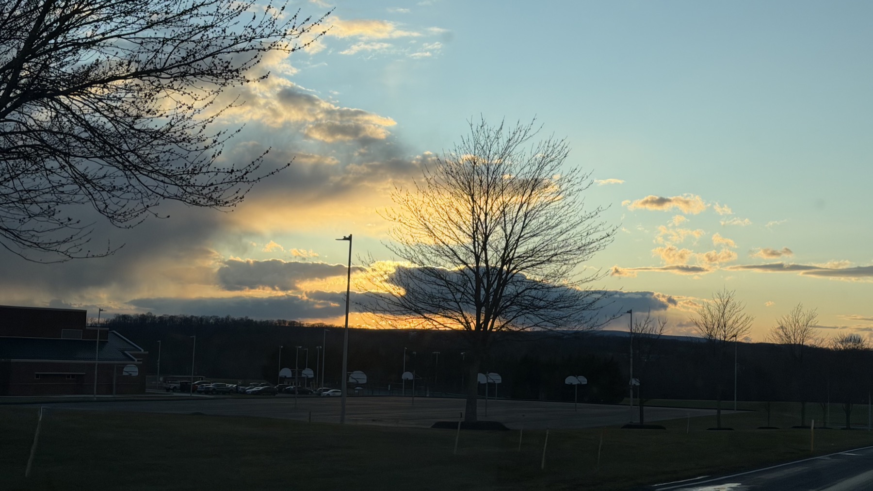 Light breaking through clouds at sunset